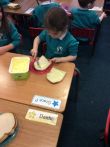 Having fun making jam sandwiches
